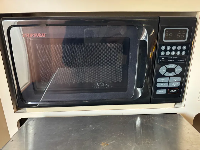 Slide: The Image of Built-in microwave in a 2005 Albin 28 Tournament Express boat kitchen. - 22
