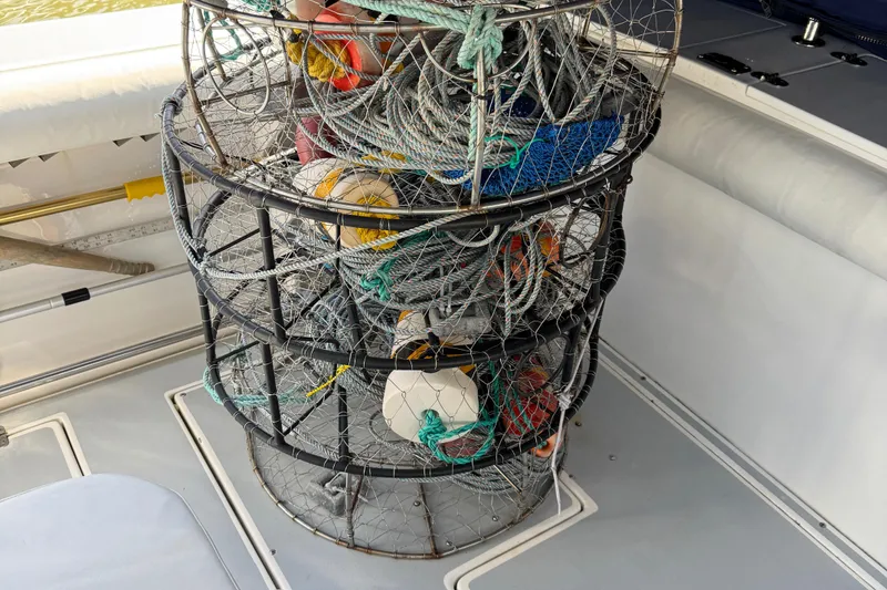 Slide: The Image of Crab traps on a 2005 Albin 28 Tournament Express boat deck. - 31