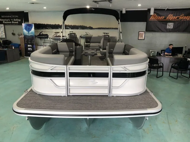 Slide: The Image of 2025 Bennington S Swingback 22 SSB pontoon boat in showroom, rear view. - 2