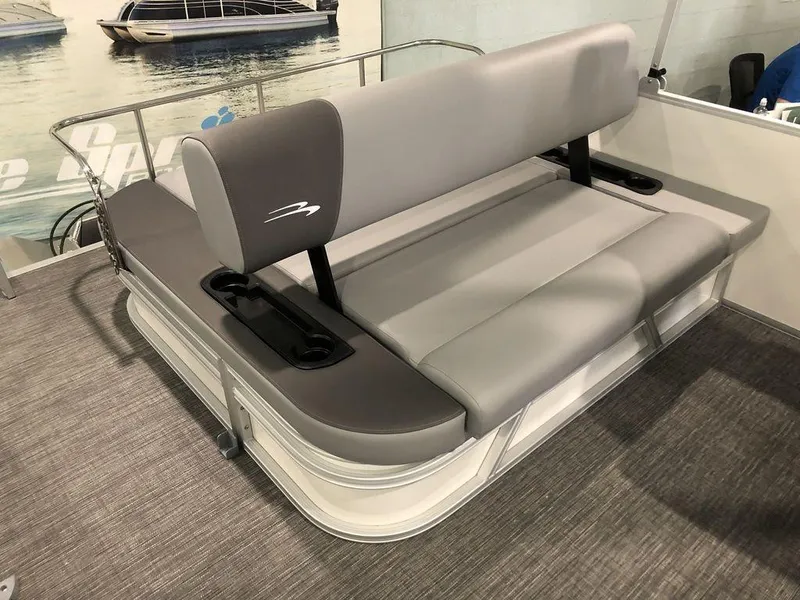Slide: The Image of 2025 Bennington S Swingback 22 SSB boat seating with gray upholstery and cup holders. - 5
