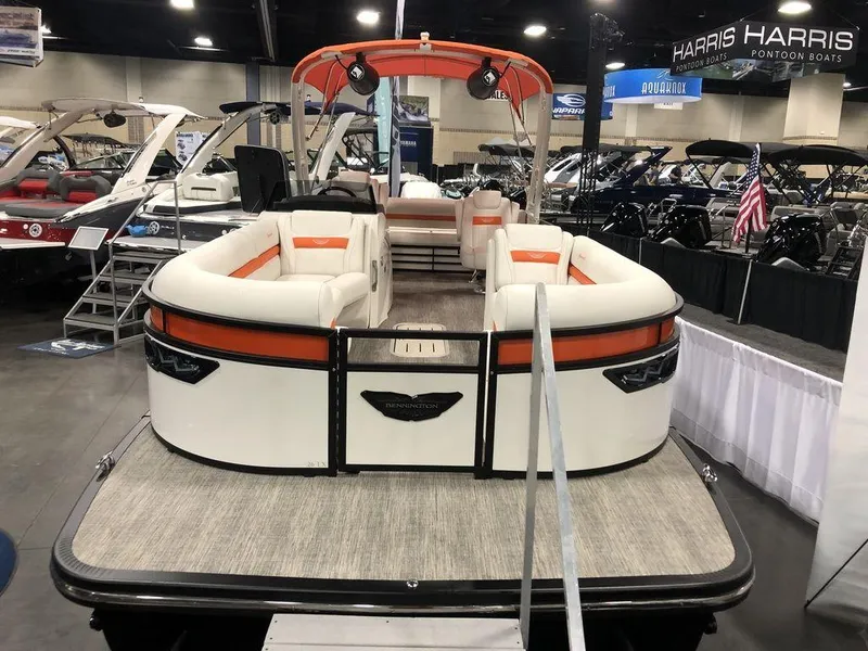 Slide: The Image of 2024 Bennington LX Sport Swingback 26 LXSSBA pontoon boat at indoor boat show. - 3