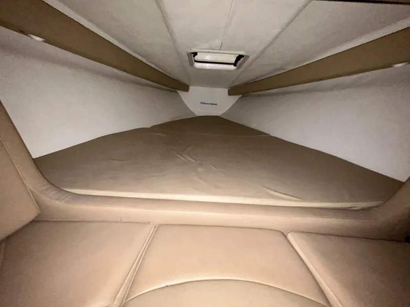 Slide: The Image of Interior cabin of 2000 Active Thunder 370 Excess boat, featuring beige upholstery. - 17