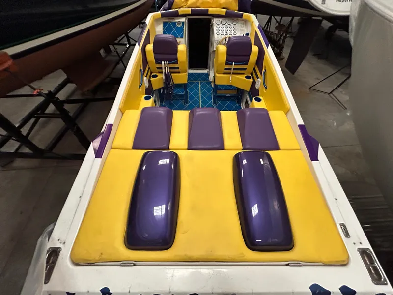 Slide: The Image of 2000 Active Thunder 370 Excess boat with vibrant yellow and purple seating. - 3