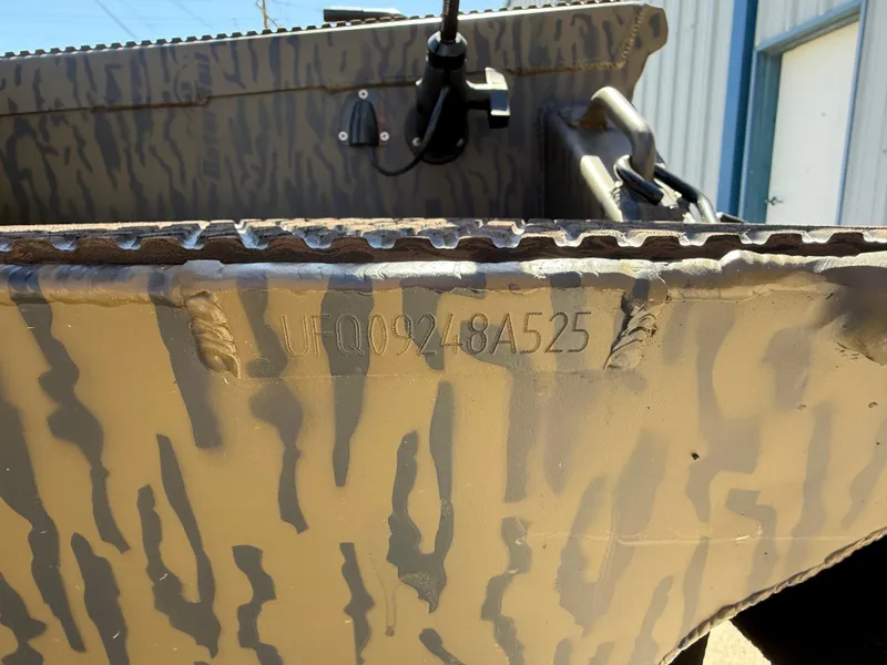 Slide: The Image of 2025 Gator Tail 1854 Extreme boat with camouflage pattern and visible serial number. - 12