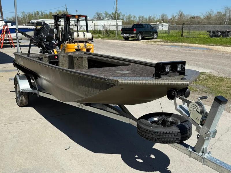 Slide: The Image of 2025 Gator Tail 1854 Extreme boat on trailer, outdoor setting. - 3