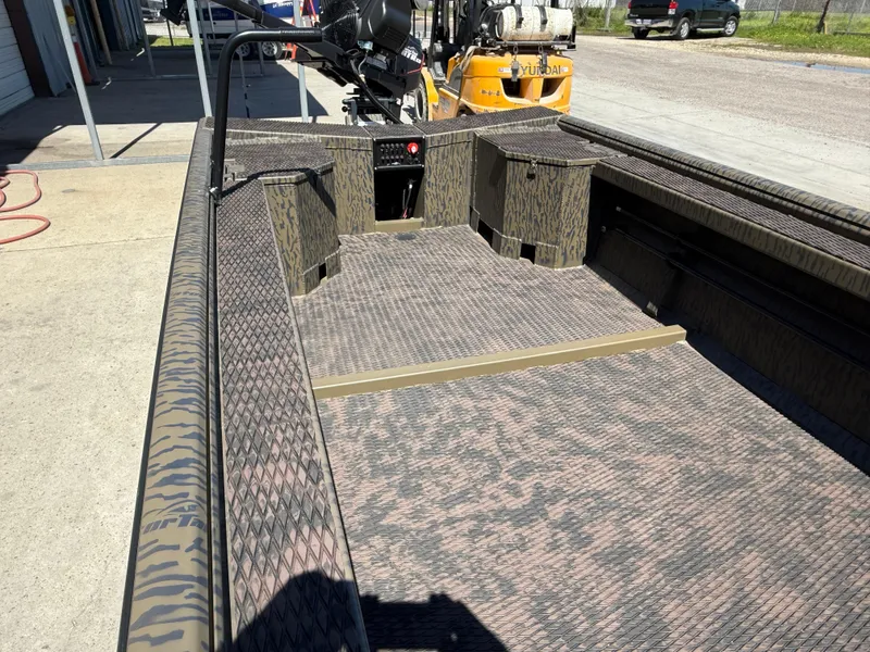 Slide: The Image of 2025 Gator Tail 1854 Extreme boat interior with textured flooring and open deck design. - 8