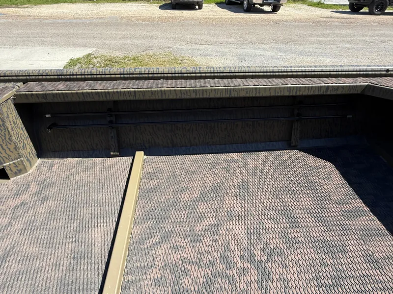 Slide: The Image of 2025 Gator Tail 1854 Extreme boat interior with textured flooring and storage space. - 9