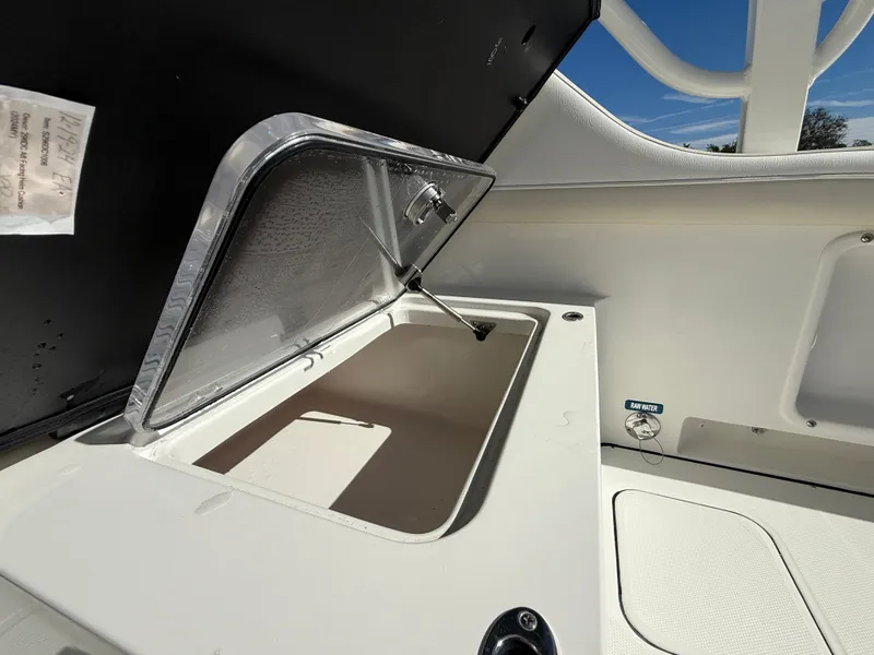 Slide: The Image of Open storage compartment on a 2025 World Cat 296 DC boat. - 10