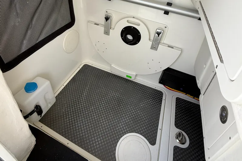 Slide: The Image of 2025 World Cat 296 DC interior with storage compartment and non-slip flooring. - 17