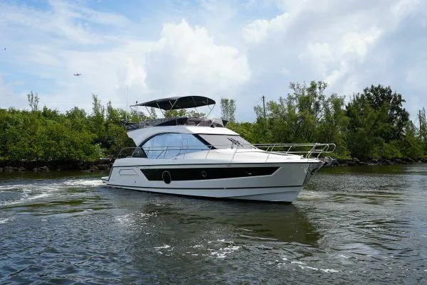 The Image of 2021 Beneteau Monte Carlo 52 yacht cruising on a scenic waterway. - 0