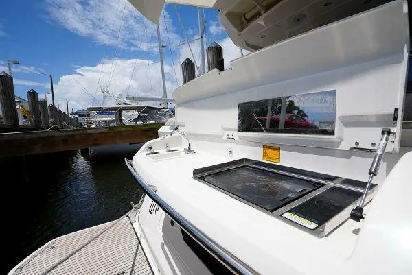 Slide: The Image of Beneteau Monte Carlo 52 yacht outdoor kitchen area, 2021 model, docked at marina. - 11