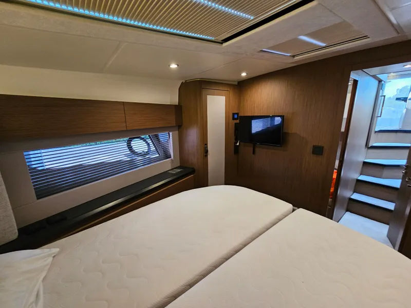 Slide: The Image of Luxurious cabin interior of 2021 Beneteau Monte Carlo 52 yacht, featuring modern design and amenities. - 22