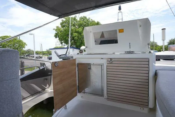 Slide: The Image of 2021 Beneteau Monte Carlo 52 yacht deck with outdoor kitchen amenities. - 9