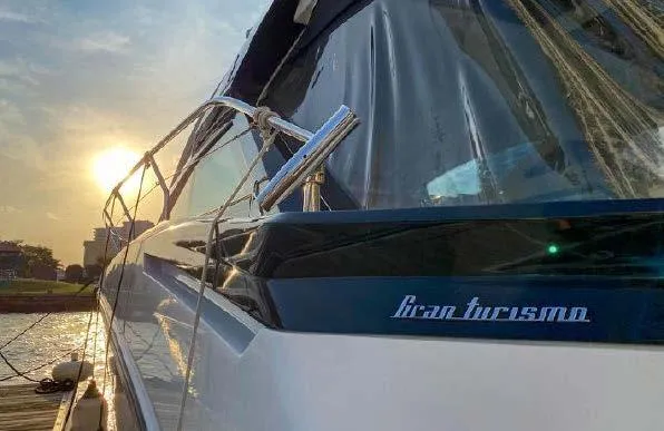 Slide: The Image of 2019 Beneteau Gran Turismo 40 yacht at sunset, docked by the water. - 25