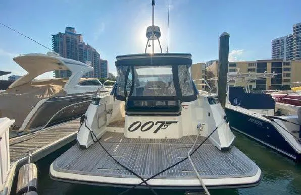 Slide: The Image of 2019 Beneteau Gran Turismo 40 yacht docked, rear view with "007" marking. - 27