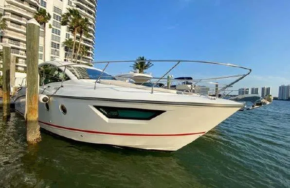 Slide: The Image of 2019 Beneteau Gran Turismo 40 yacht docked near waterfront buildings. - 28