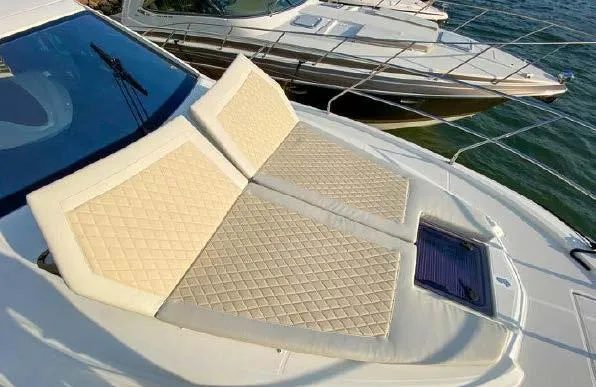 Slide: The Image of 2019 Beneteau Gran Turismo 40 yacht with sunbathing cushions on deck. - 35