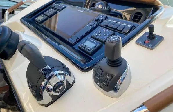 Slide: The Image of Control panel of a 2019 Beneteau Gran Turismo 40 yacht with navigation equipment. - 37
