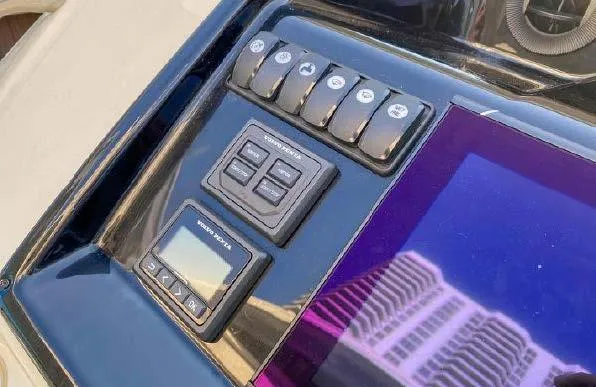 Slide: The Image of Control panel of 2019 Beneteau Gran Turismo 40 yacht with digital display and switches. - 39