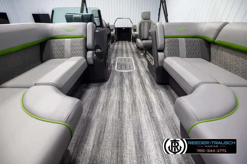 Slide: The Image of 2025 Bennington MFBSE boat interior with gray and green seating, modern design. - 13