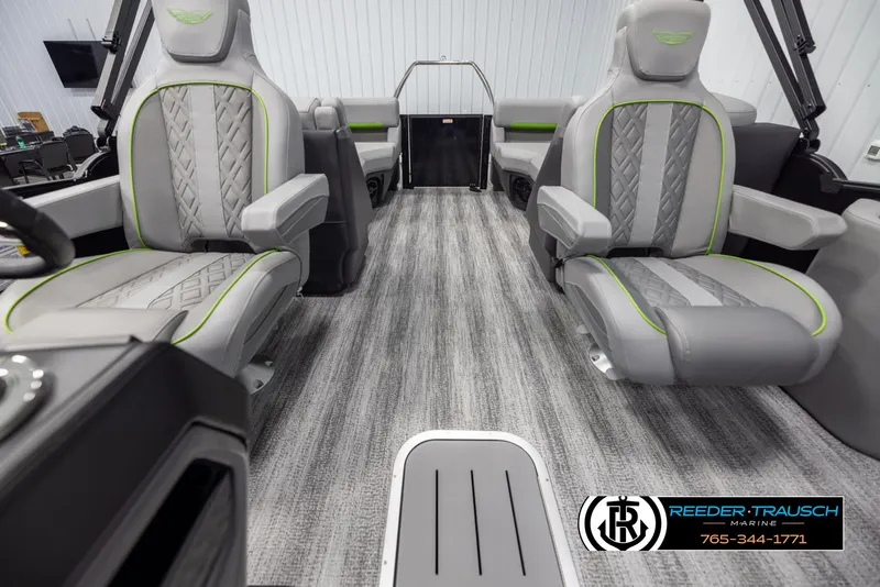 Slide: The Image of 2025 Bennington MFBSE boat interior with gray and green seating, carpeted flooring. - 14