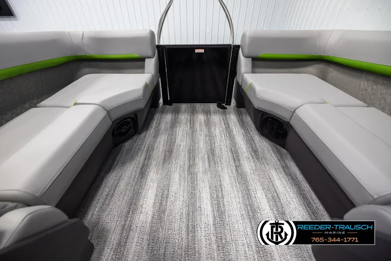Slide: The Image of 2025 Bennington MFBSE boat interior with gray seating and green accents. - 15