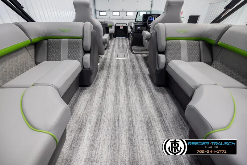 Slide: The Image of Interior of a 2025 Bennington MFBSE boat with gray and green seating. - 16
