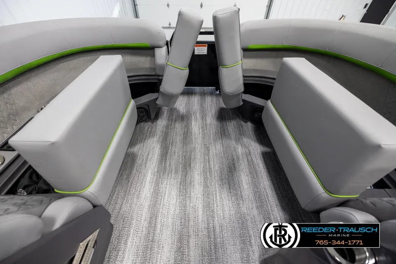 Slide: The Image of 2025 Bennington MFBSE boat interior with gray seating and green accents. - 19