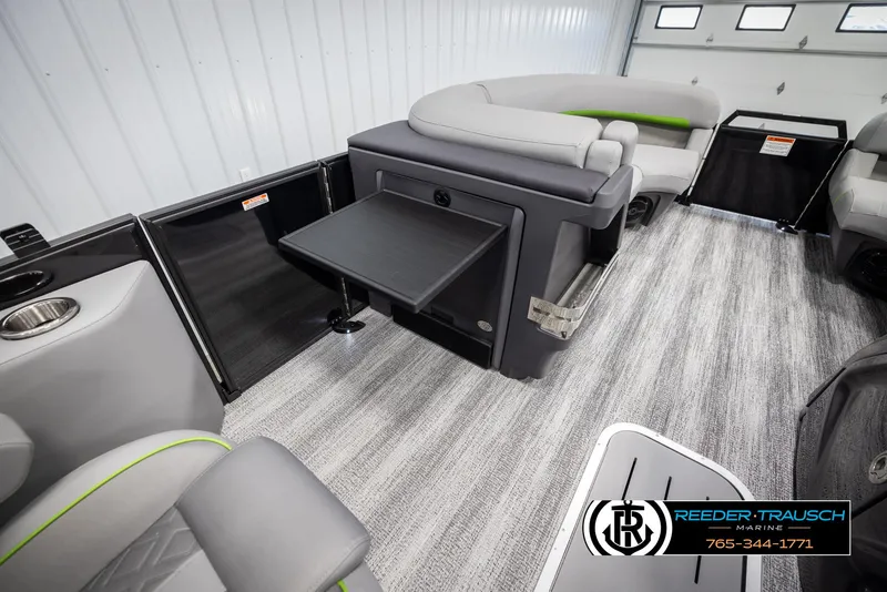 Slide: The Image of 2025 Bennington MFBSE boat interior with gray seating and foldable table. - 23