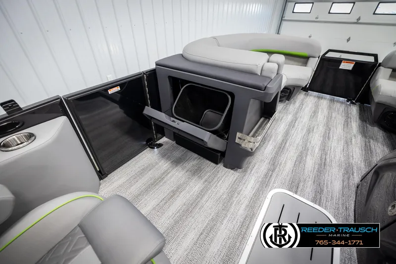 Slide: The Image of 2025 Bennington MFBSE boat interior with gray seating and storage compartments. - 24