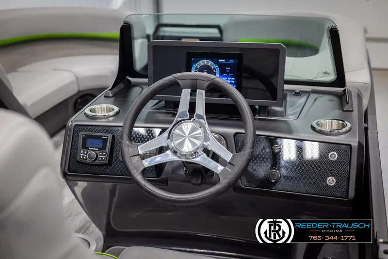 Slide: The Image of 2025 Bennington MFBSE boat dashboard with modern steering wheel and digital display. - 27