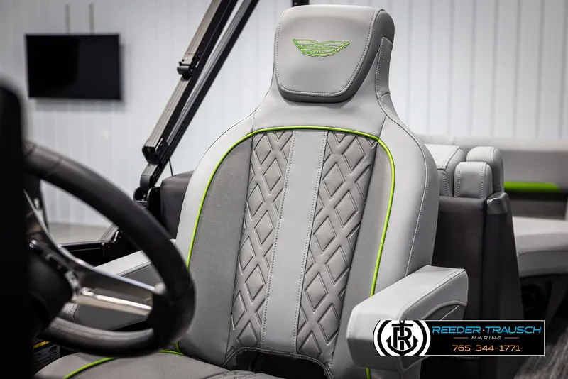 Slide: The Image of 2025 Bennington MFBSE boat seat with gray upholstery and green accents. - 35
