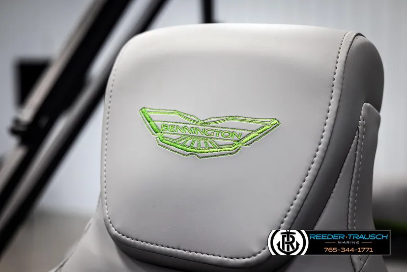 Slide: The Image of 2025 Bennington MFBSE seat with green embroidered logo, showcasing luxury design. - 36