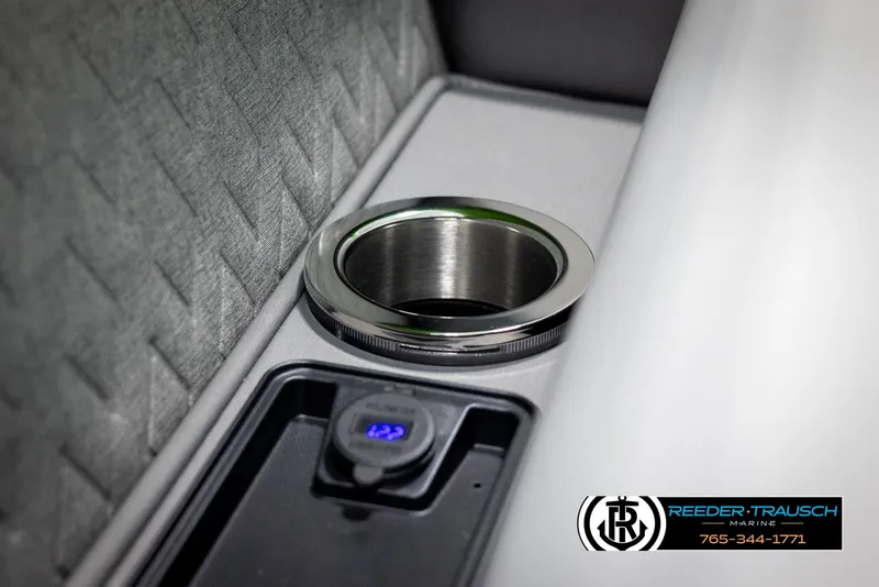 Slide: The Image of 2025 Bennington MFBSE interior with cup holder and USB port, featuring quilted upholstery. - 40