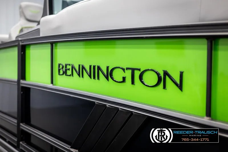 Slide: The Image of 2025 Bennington MFBSE boat with vibrant green detailing, Reeder-Trausch Marine branding. - 46