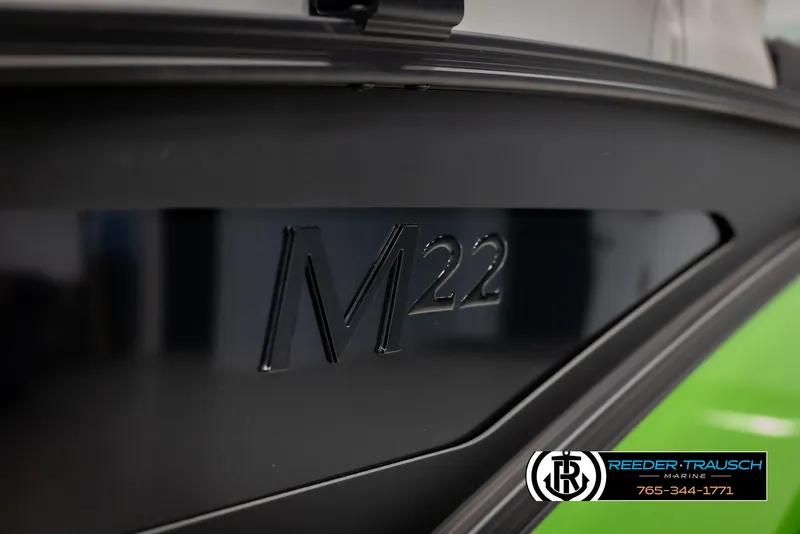 Slide: The Image of 2025 Bennington MFBSE boat with M22 marking, Reeder-Trausch Marine logo visible. - 47