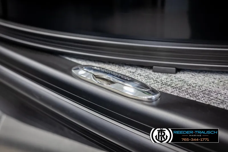 Slide: The Image of 2025 Bennington MFBSE boat detail with Reeder-Trausch Marine branding. - 48