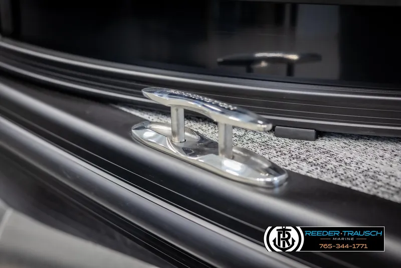 Slide: The Image of 2025 Bennington MFBSE boat cleat detail with Reeder-Trausch Marine logo. - 49