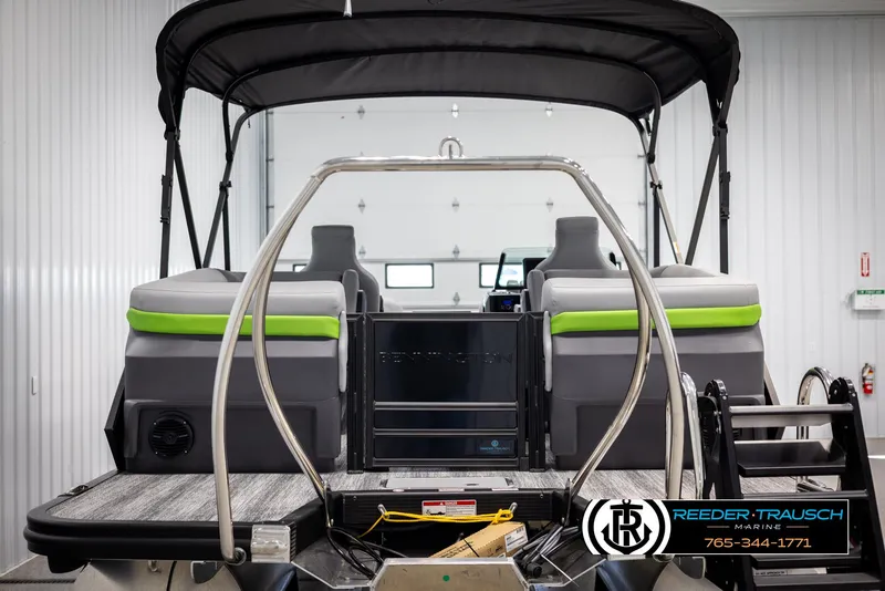 Slide: The Image of 2025 Bennington MFBSE boat interior with seating and canopy in showroom. - 7
