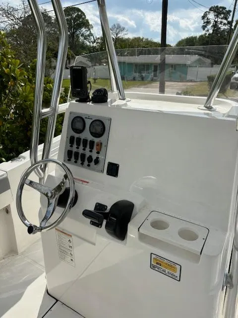 Slide: The Image of 2016 Release 208 RX boat console with steering wheel and control panel. - 11