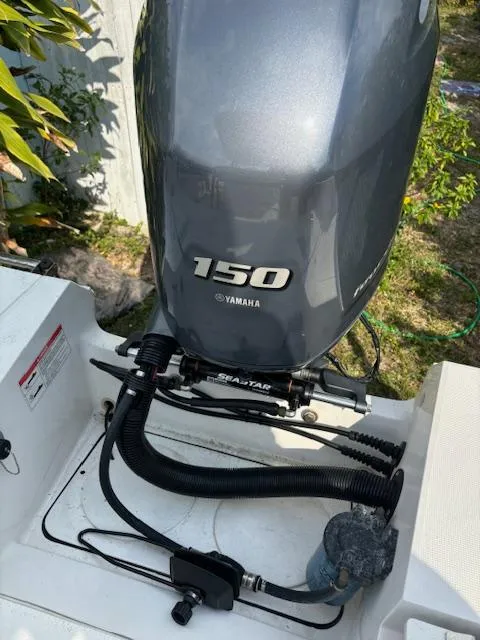 Slide: The Image of Yamaha 150 outboard motor on 2016 Release 208 RX boat, featuring SeaStar steering system. - 20