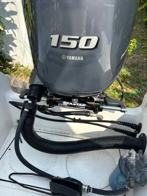 Slide: The Image of Yamaha 150 outboard motor on a 2016 Release 208 RX boat with SeaStar hydraulic steering. - 21