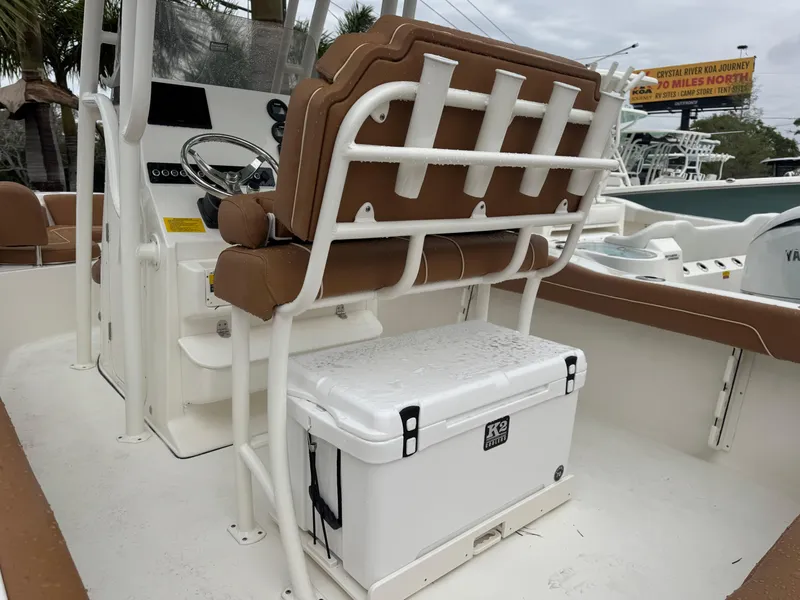 Slide: The Image of 2025 Key West 219 FS boat interior with seating and cooler. - 11