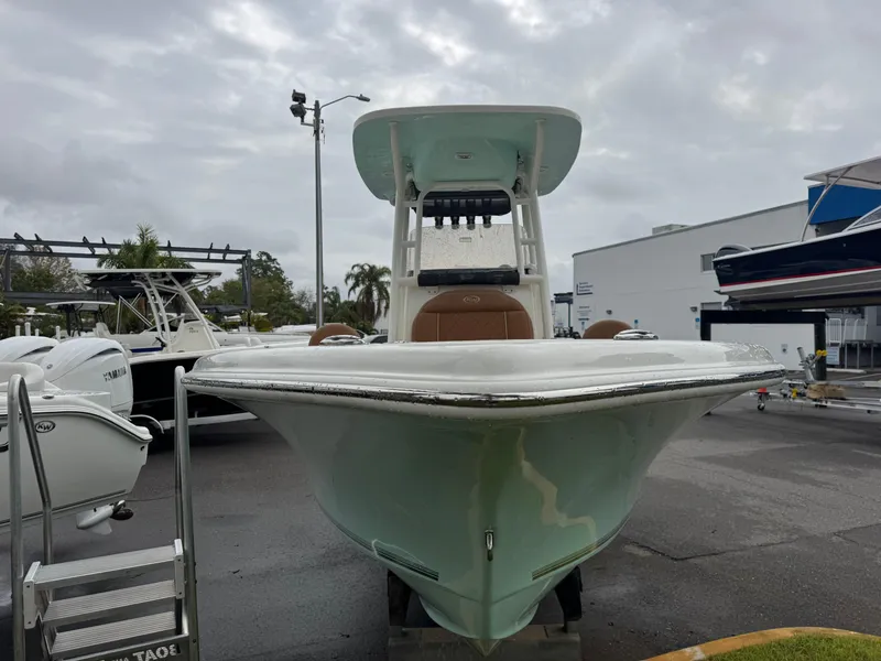 Slide: The Image of 2025 Key West 219 FS boat displayed outdoors on a cloudy day. - 3