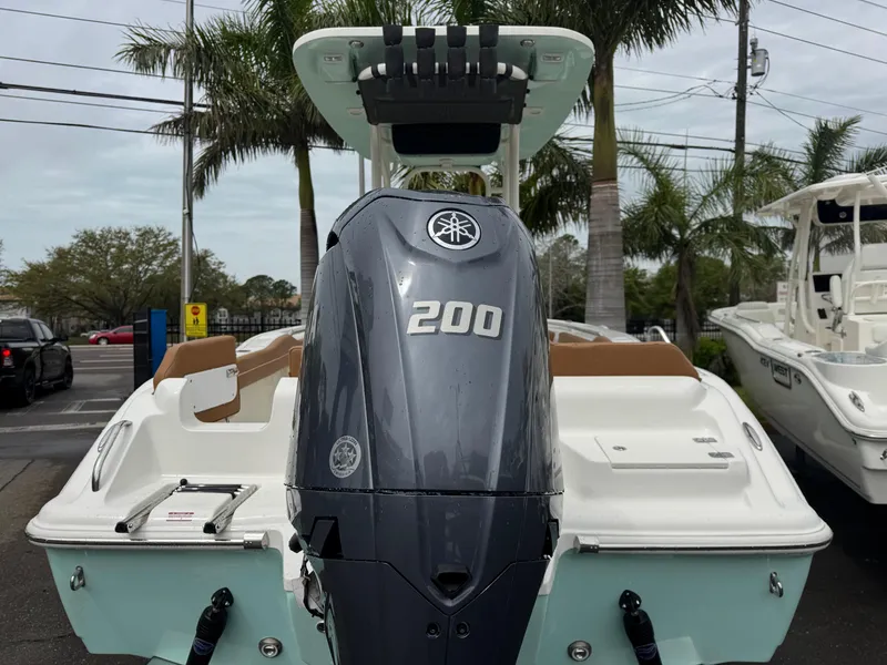 Slide: The Image of 2025 Key West 219 FS boat with Yamaha 200 engine, displayed outdoors. - 8