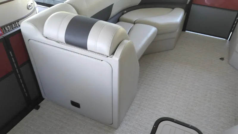 Slide: The Image of Interior seating of 2022 Xcursion 243RFX boat with beige upholstery. - 13