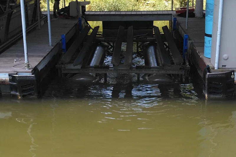 Slide: The Image of Boat lift system at a dock, designed for Xcursion 243RFX, 2022 model. - 17