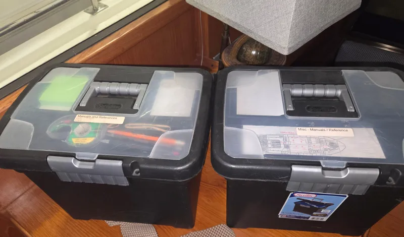 Slide: The Image of Storage boxes on a 1989 Marine Trader 47 CMY boat, containing tools and manuals. - 27