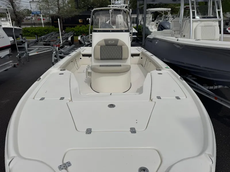 Slide: The Image of 2025 Key West 210 Bay Reef boat, white exterior, docked at marina. - 15