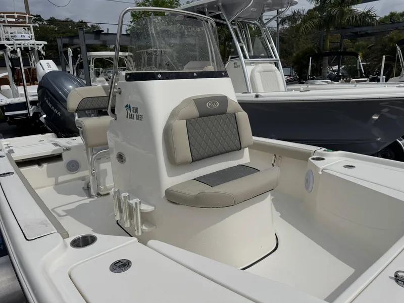 Slide: The Image of 2025 Key West 210 Bay Reef boat interior with seating and console. - 16